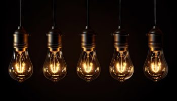 A row of light bulbs hanging on a wire created with Generative AI technology
